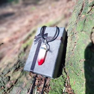 Red-tipped quartz crystal point pendant necklace on black cord